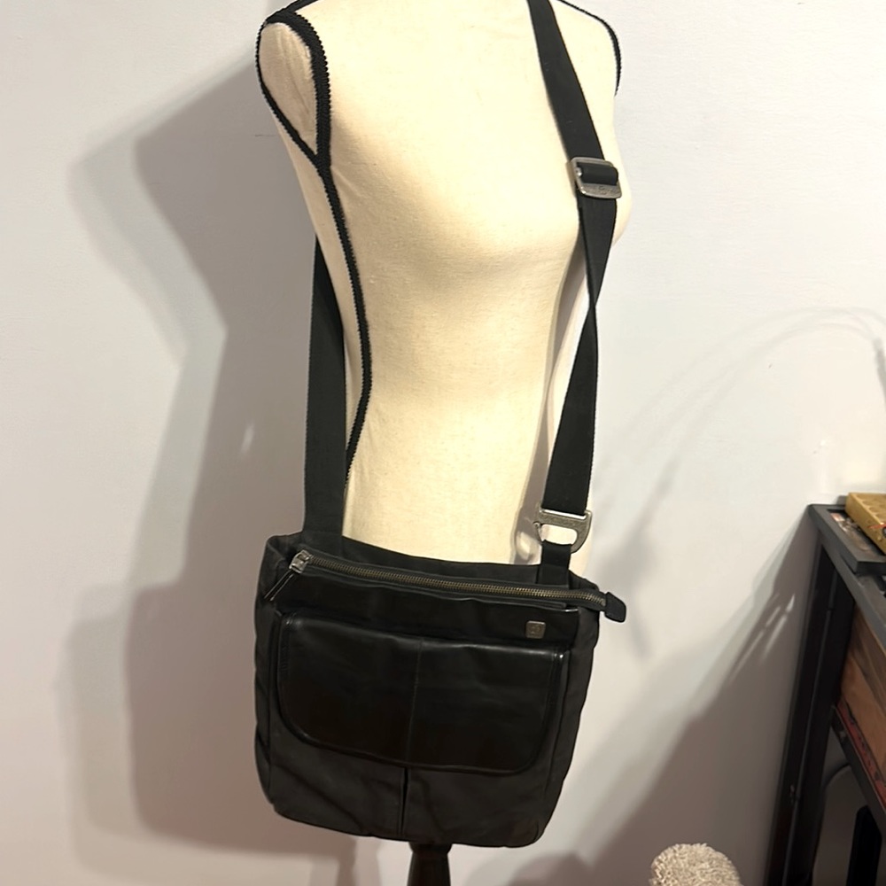 Tumi leather and canvas shoulder bag slightly used